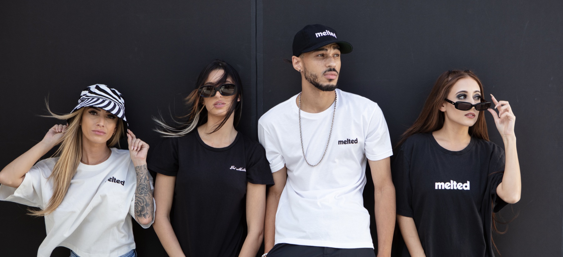 Four members of the Melted collective in Melted tees
